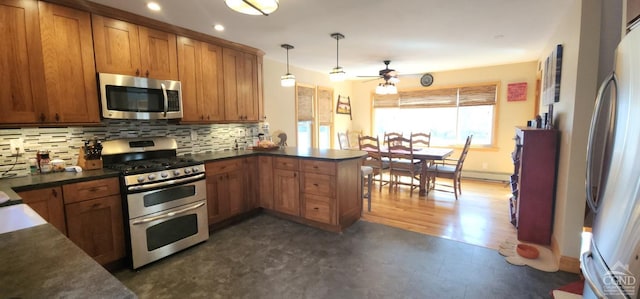 273 E Conesville Rd, Conesville, NY 12076 - kitchen featuring appliances with stainless steel finishes, a peninsula, brown cabinets, ceiling fan, and recessed lighting