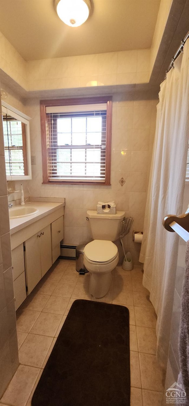 273 E Conesville Rd, Conesville, NY 12076 - full bathroom with tile patterned floors, vanity, a baseboard heating unit, tile walls, and a shower with curtain