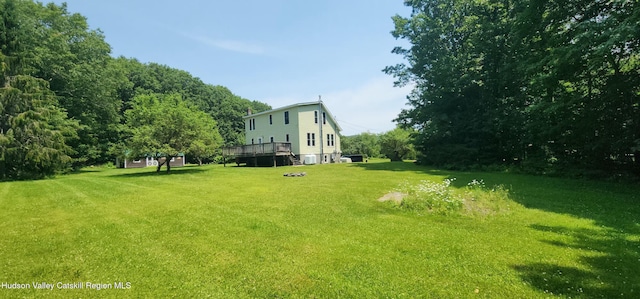 273 E Conesville Rd, Conesville, NY 12076 - view of green lawn with a wooden deck