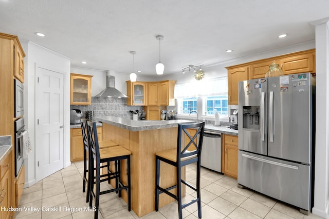 8 Orlich Rd, Red Hook, NY 12571 - kitchen with appliances with stainless steel finishes, wall chimney exhaust hood, glass insert cabinets, a kitchen island, and a breakfast bar