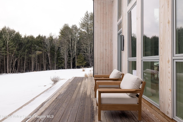 view of snow covered deck