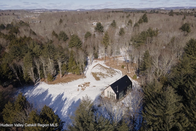 bird's eye view featuring a wooded view