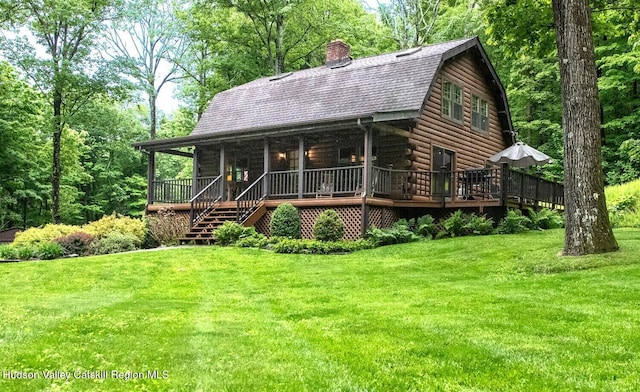 1206 Hollow Rd, Clinton, NY 12514 - log-style house featuring a gambrel roof, a front lawn, a chimney, and log exterior