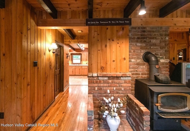 1206 Hollow Rd, Clinton, NY 12514 - hallway with light wood-type flooring, wooden walls, and wood ceiling with exposed beams