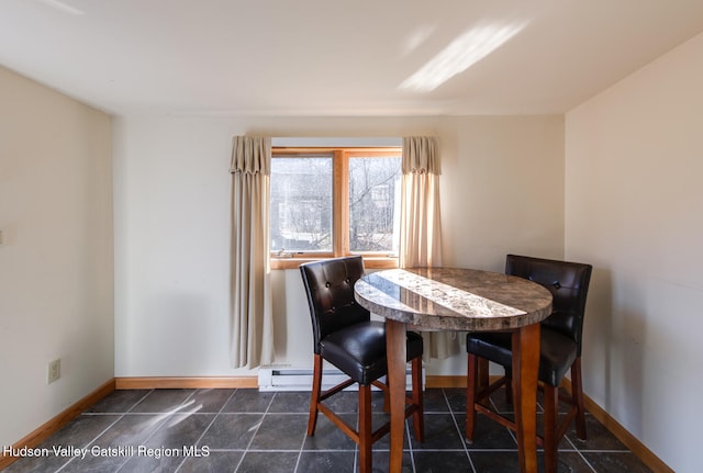 dining room with a baseboard radiator