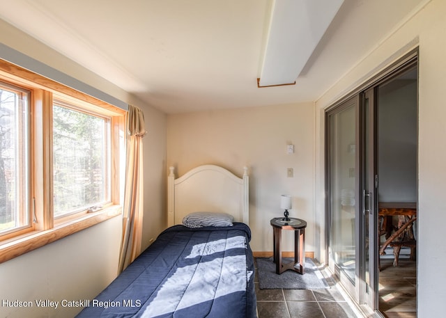 bedroom with dark wood-type flooring