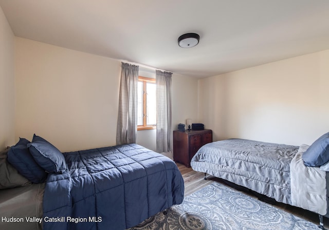 bedroom featuring hardwood / wood-style floors