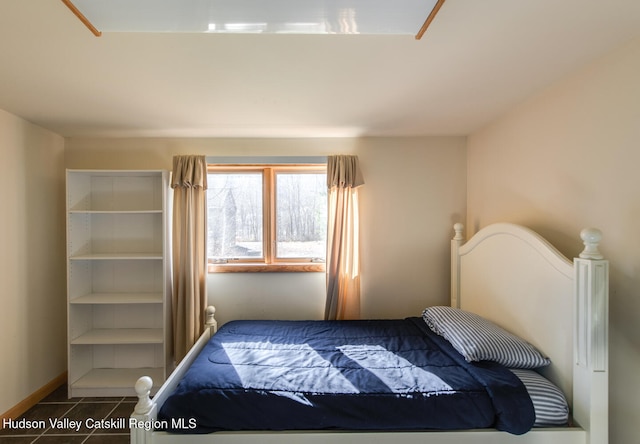 bedroom with tile patterned floors