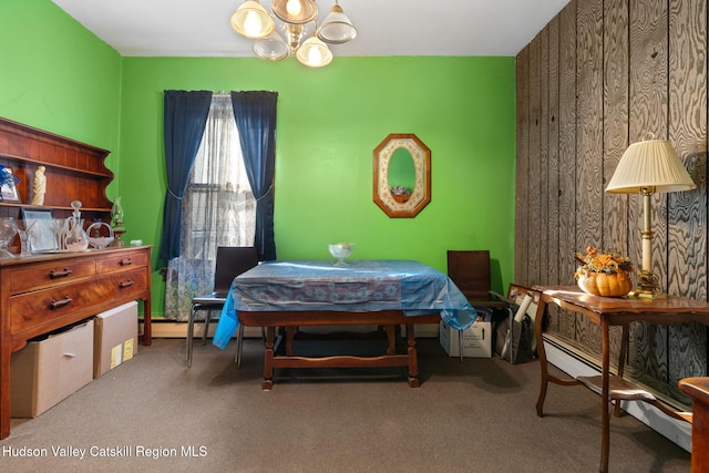 carpeted bedroom with a notable chandelier and wood walls