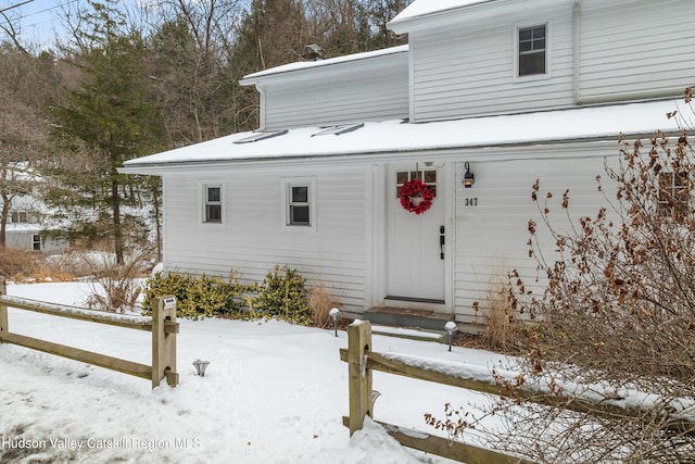 view of snow covered property entrance