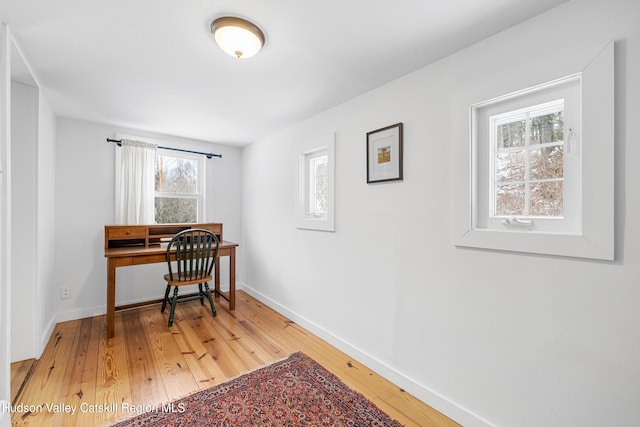 office featuring wood finished floors and baseboards