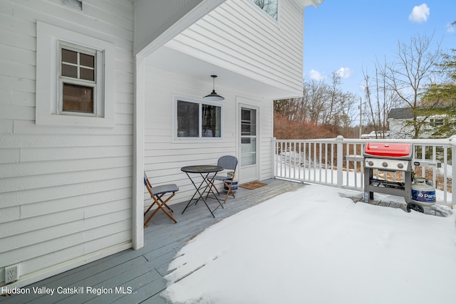 view of snow covered deck