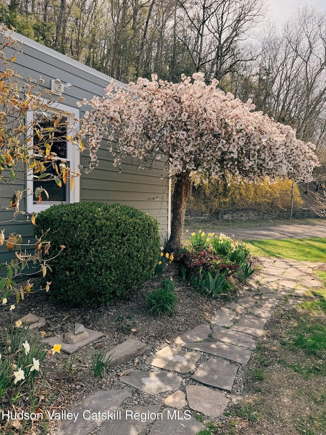view of side of home with an attached garage