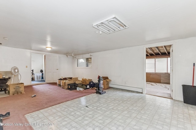 below grade area featuring a baseboard radiator