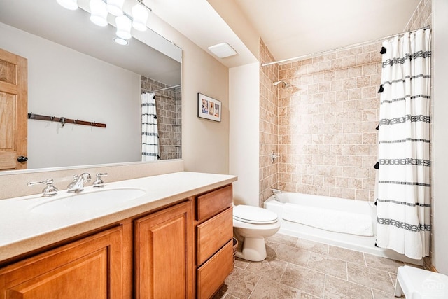full bathroom featuring toilet, shower / tub combo with curtain, and vanity