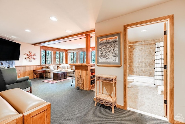 living area with carpet flooring, recessed lighting, and wainscoting
