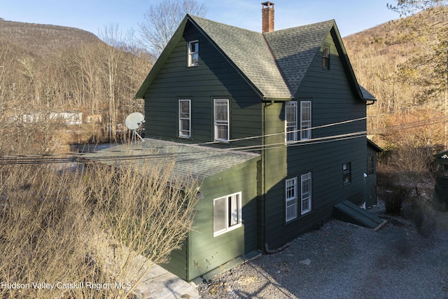 view of home's exterior featuring a mountain view