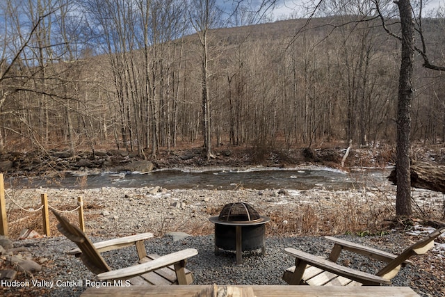 view of yard with a fire pit