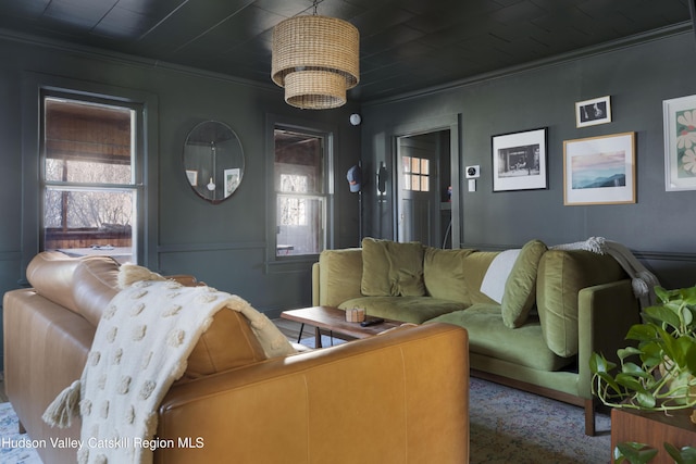 living room featuring crown molding