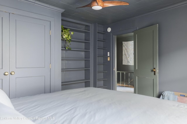 bedroom featuring ceiling fan and ornamental molding