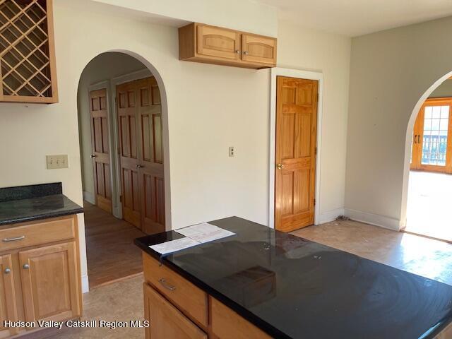 kitchen featuring light hardwood / wood-style floors and light brown cabinets