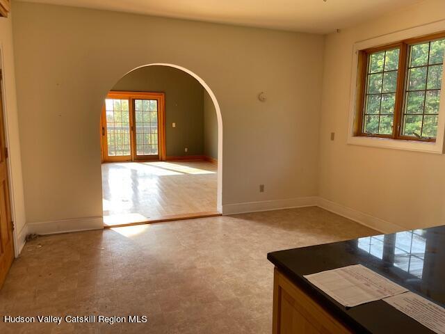 spare room with plenty of natural light