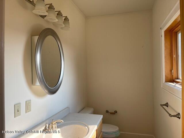 bathroom with vanity and toilet