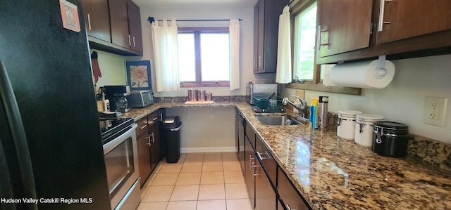 176 Rusk Hollow Rd, Hunter, NY 12442 - kitchen with freestanding refrigerator, stainless steel electric range, light tile patterned flooring, light stone counters, and dark brown cabinetry