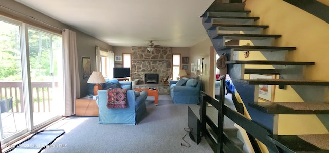 176 Rusk Hollow Rd, Hunter, NY 12442 - living area featuring carpet, a stone fireplace, stairway, and ceiling fan