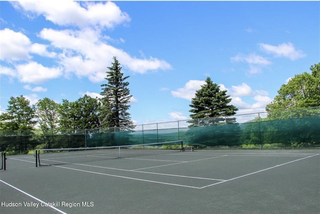 view of sport court with fence