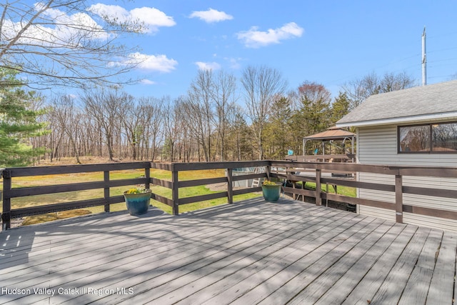 wooden terrace with a gazebo