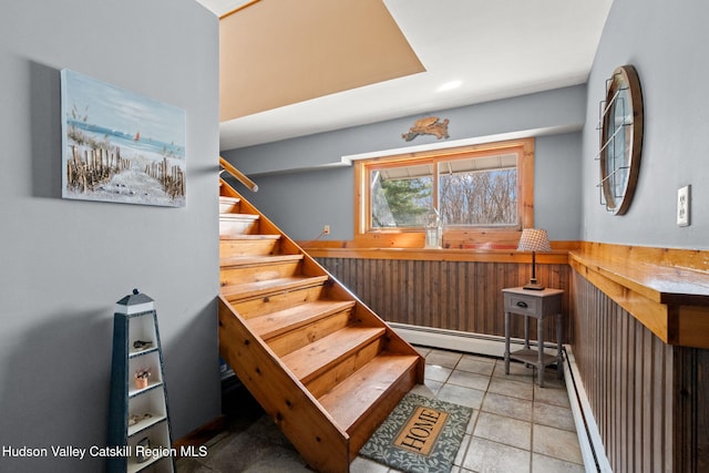 stairs featuring a baseboard radiator