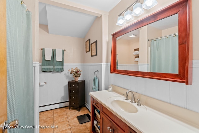 bathroom with tile patterned floors, a wainscoted wall, vanity, and a baseboard radiator