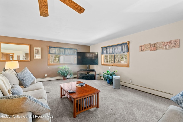 living room featuring carpet flooring, baseboard heating, and baseboards