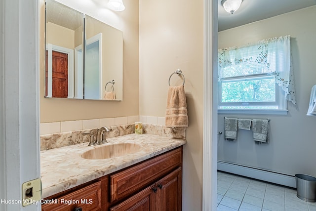 22 Lainey Ln, Kingston, NY 12401 - bathroom featuring baseboard heating, vanity, and tile patterned flooring