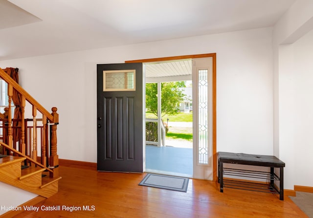 33 Camelot Ct, Saugerties, NY 12477 - entrance foyer with wood finished floors, stairway, and baseboards