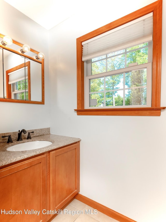 33 Camelot Ct, Saugerties, NY 12477 - bathroom with healthy amount of natural light, vanity, and tile patterned flooring