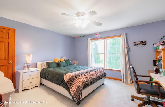33 Camelot Ct, Saugerties, NY 12477 - bedroom with light carpet, baseboards, a ceiling fan, and a desk