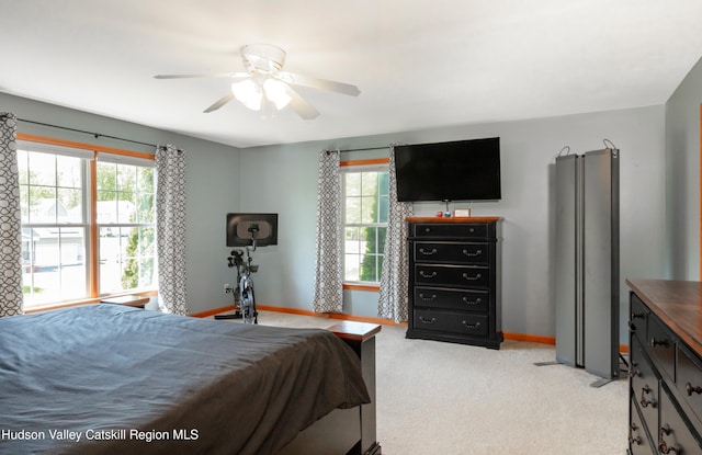 33 Camelot Ct, Saugerties, NY 12477 - bedroom with multiple windows, baseboards, light colored carpet, and a ceiling fan