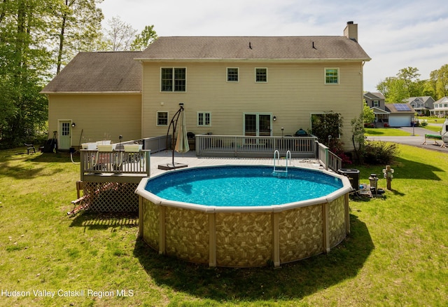 33 Camelot Ct, Saugerties, NY 12477 - view of pool with a wooden deck and a lawn