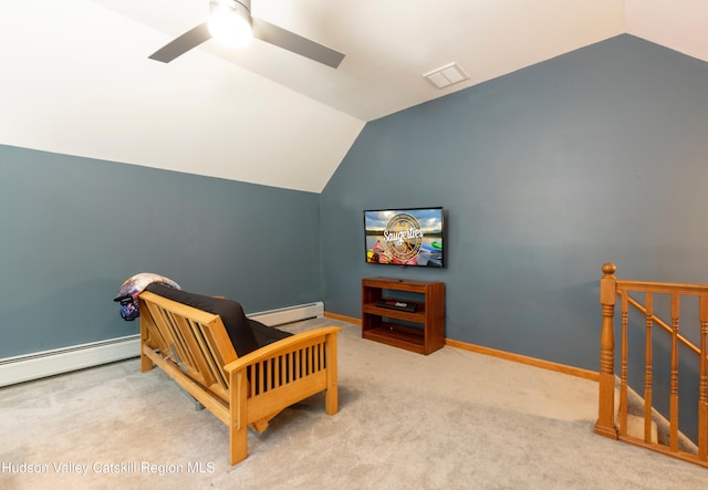 33 Camelot Ct, Saugerties, NY 12477 - living area featuring baseboard heating, vaulted ceiling, ceiling fan, carpet floors, and an upstairs landing