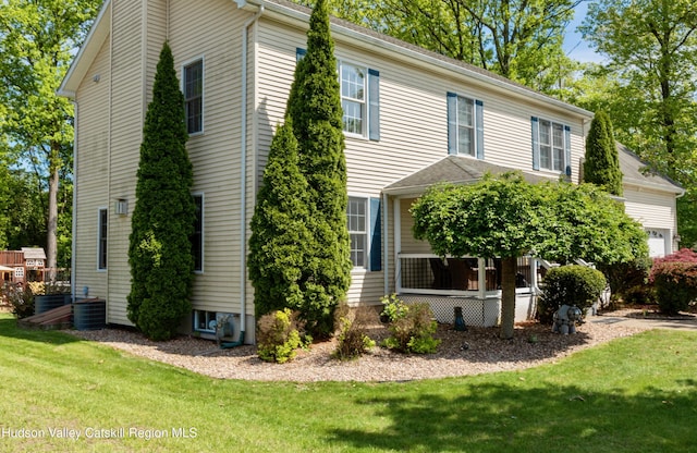 33 Camelot Ct, Saugerties, NY 12477 - view of property exterior featuring a yard and central AC