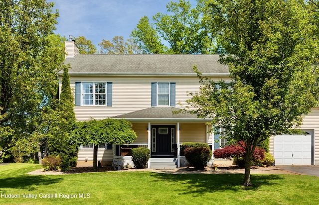 33 Camelot Ct, Saugerties, NY 12477 - view of front of property with a chimney, a front lawn, a porch, and concrete driveway