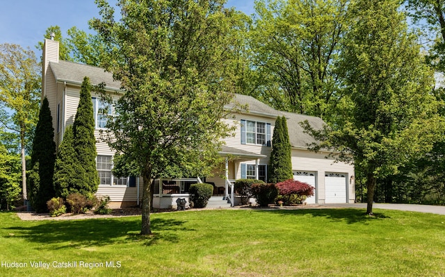 33 Camelot Ct, Saugerties, NY 12477 - obstructed view of property with a chimney, driveway, a porch, a front lawn, and a garage