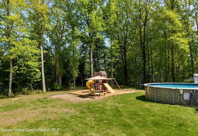33 Camelot Ct, Saugerties, NY 12477 - view of jungle gym with an outdoor pool and a yard