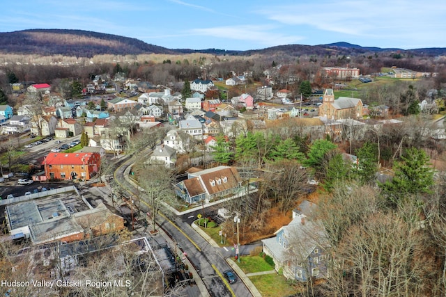 drone / aerial view featuring a mountain view