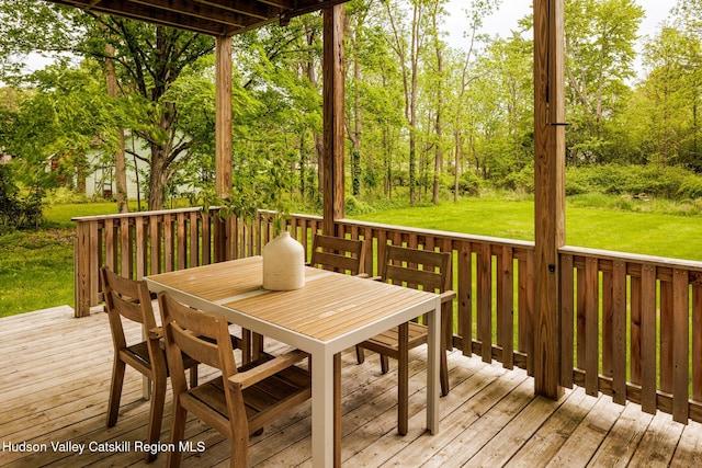 14 Bushnell Ave, Chatham, NY 12037 - wooden terrace with outdoor dining area and a yard