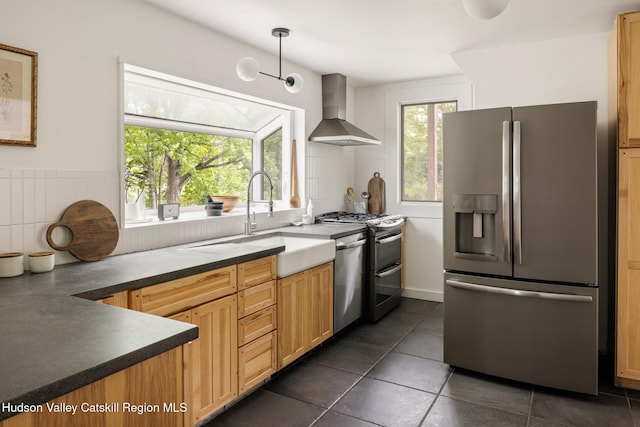 14 Bushnell Ave, Chatham, NY 12037 - kitchen with appliances with stainless steel finishes, wall chimney range hood, a sink, dark countertops, and dark tile patterned flooring