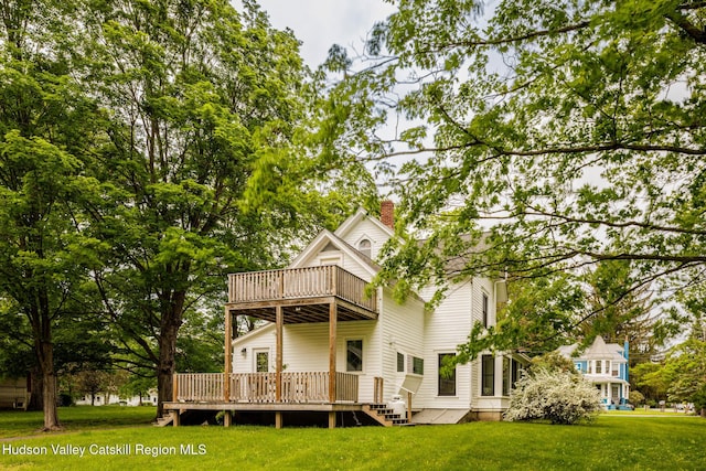 14 Bushnell Ave, Chatham, NY 12037 - back of property featuring a balcony, a chimney, and a yard