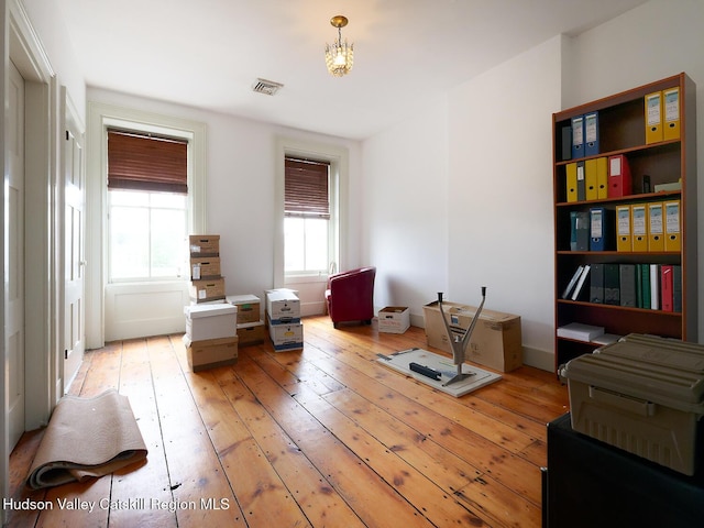 230 Warren St, Hudson, NY 12534 - sitting room featuring light wood-style floors and a chandelier